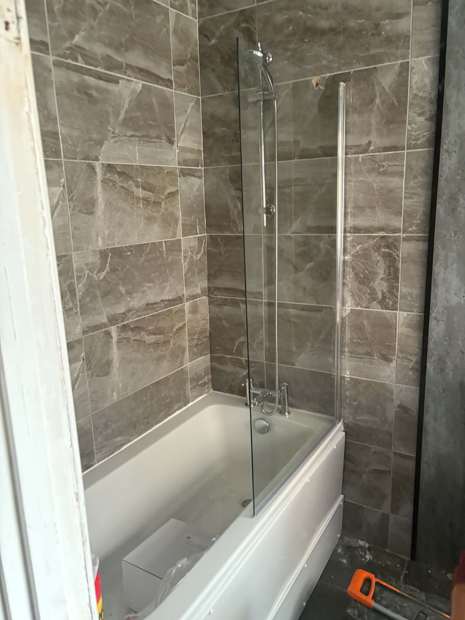 Marble walk-in shower with skylight, fitted by Heat2O Northeast