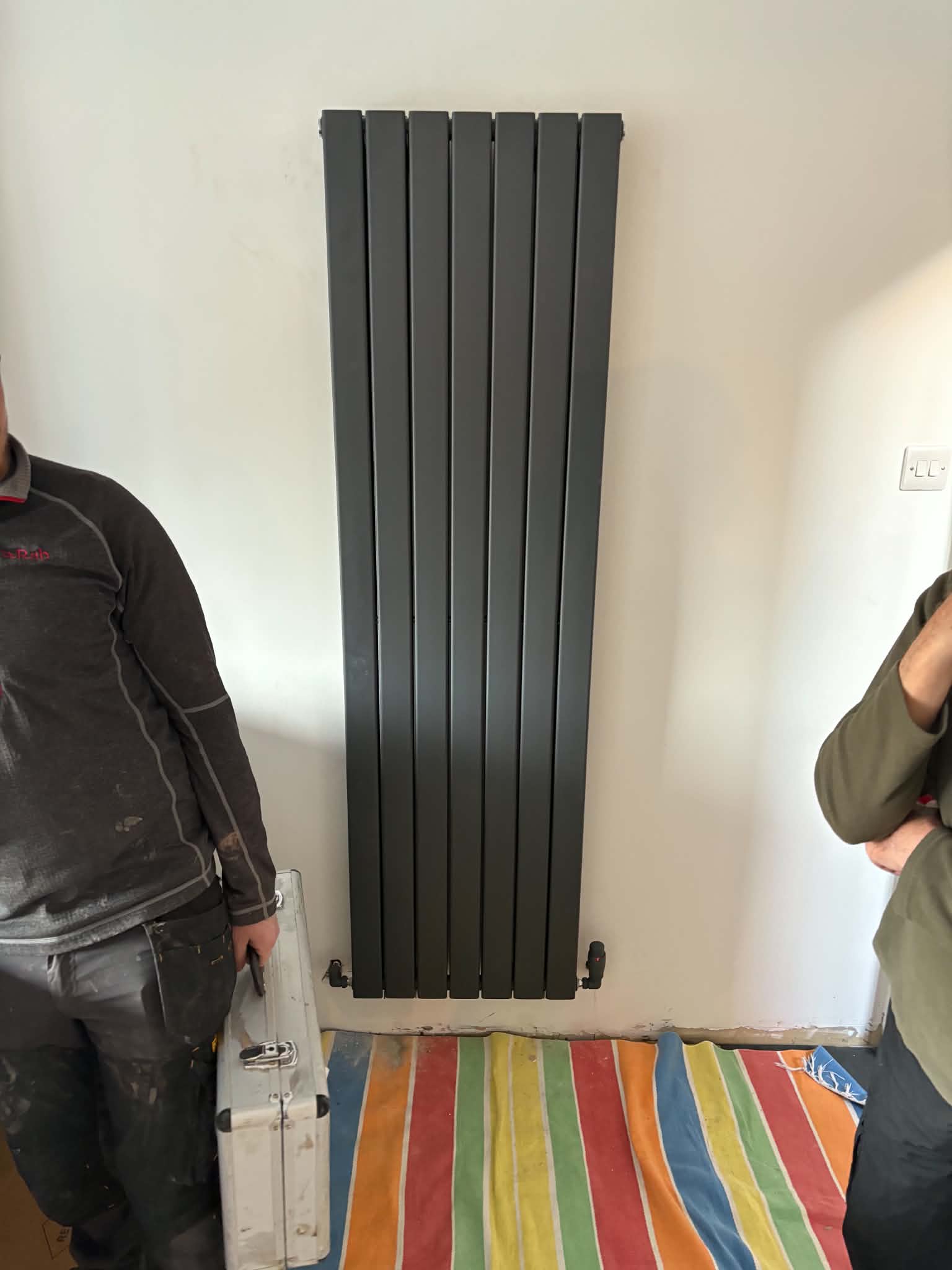 Vertical anthracite radiator install in Gateshead